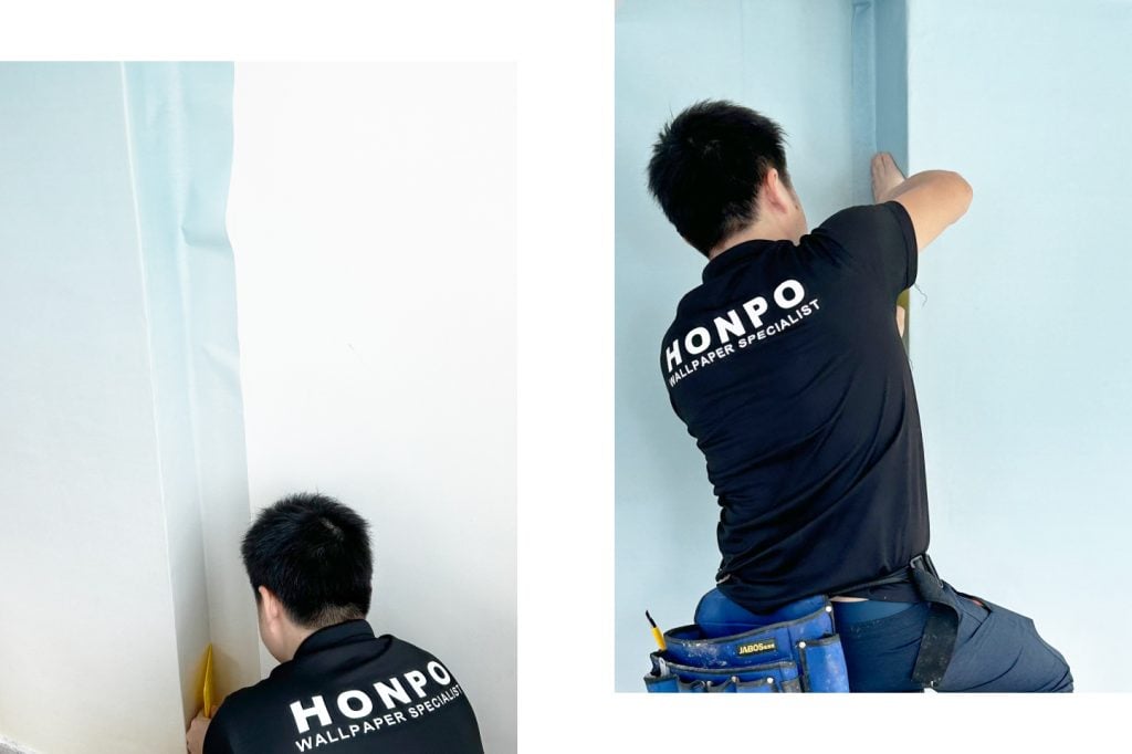 office interior design: process our team installing the wallpaper