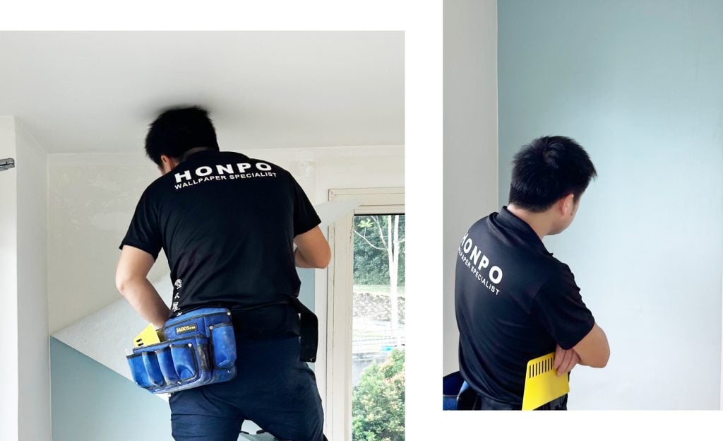 office interior design: process our team installing the wallpaper