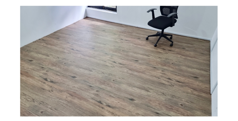 a perfect room filled with a glamorous wood flooring with one chair